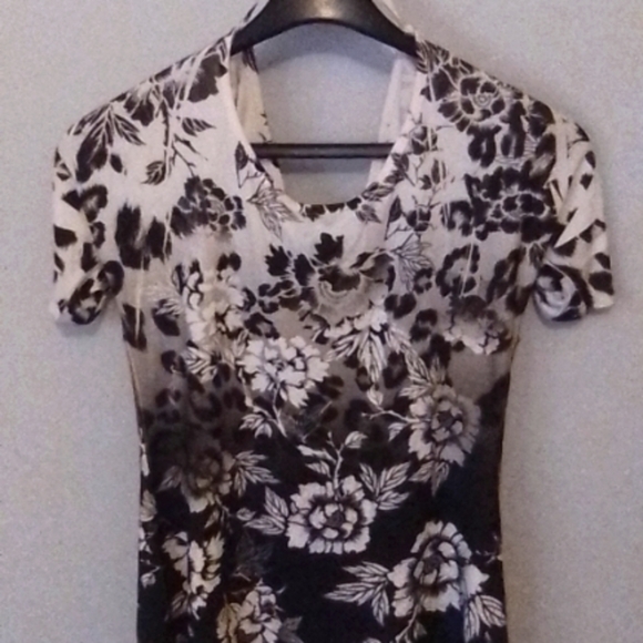 This is a dots medium white to black shirt that flares out at the bottom. - Picture 2 of 4